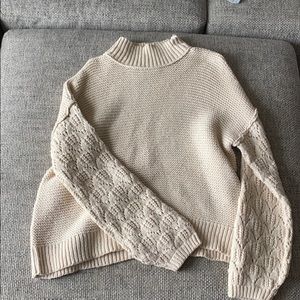 Cream sweater with fun sleeve detail